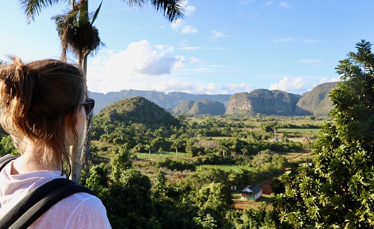 Valle de Vinales : a tourist looking the view - Cuba