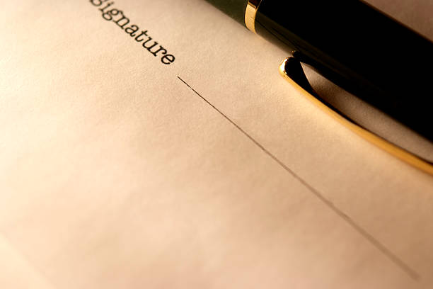 istock Sepia toned Image of blank contract with ball-point pen 182877018