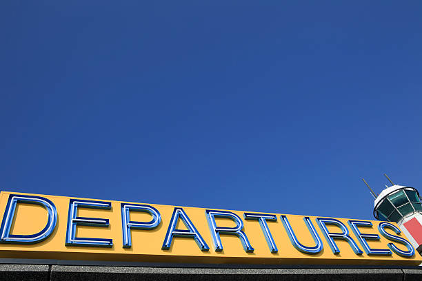 istock departures sign and flight control tower 182877744