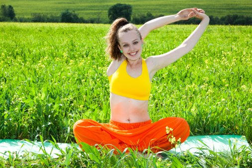 Woman Practices Yoga