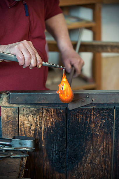 istock Hands of glass blower with pliers at work 182878786