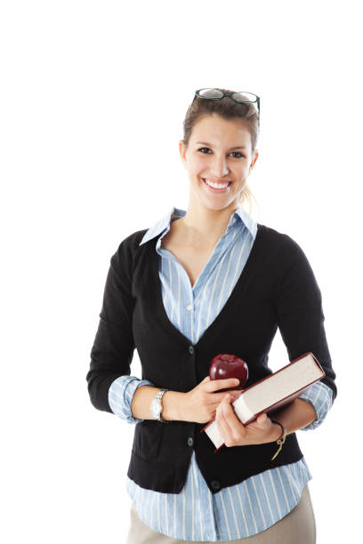 istock Happy Female Teacher Holding Apple and Book 182878938