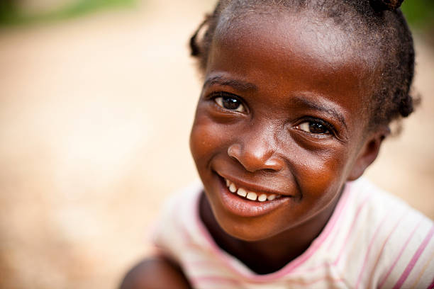 istock Young girl smiling at the camera 182878981