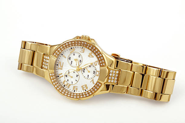 istock Women's crystal accented gold watch 182879100