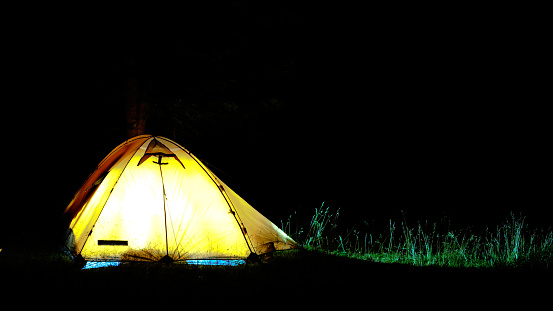 Tent in the dark lightened from interior