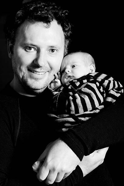 istock Father with Newborn Baby Daughter 182879980