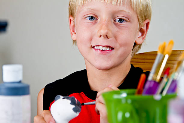 istock Caucasian Blond Little Boy Painting Pottery 182880471