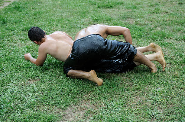 Turkish Oil Wrestling Oil wrestling (Turkish: yağlı güreş) is the Turkish national sport. It is known sometimes as grease wrestling because the wrestlers douse themselves with olive oil. greco stock pictures, royalty-free photos & images