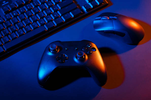 istock Gaming concept on black background with computer keyboard and joystick 1828807043