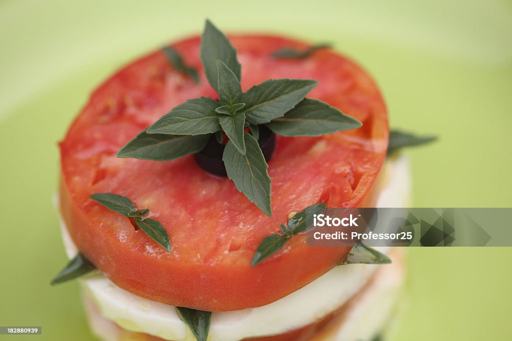 Capri "Caprese (tomato slices, mozzarella and  basil leaves). Close-up." Basil Stock Photo
