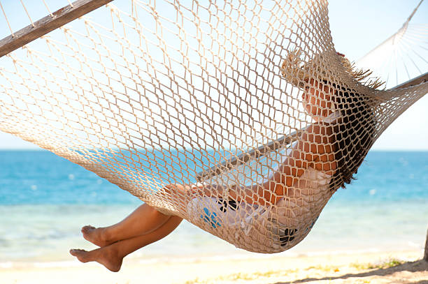 istock Woman relaxing sitting in a hammock 182881366