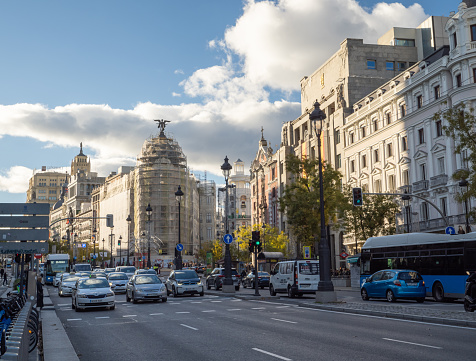 Madrid, Spain, December 1, 2023: view of Calle de Alcalá towards the center of Madrid with its famous Metrópolis building under construction