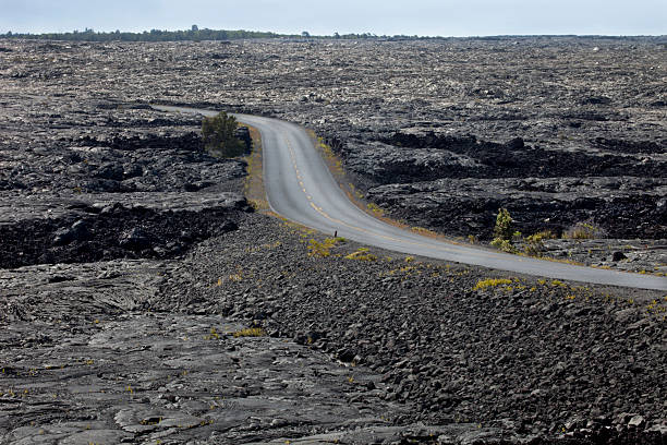 istock Empty Two Lane Road through Hawaiian Lava Field 182881512