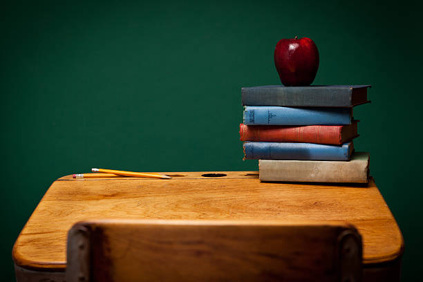 Old  leather briefcase  and book on wooden table