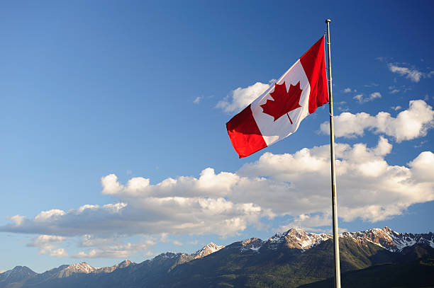 istock Canadian Flag Over the Rocky Mountains 182881610