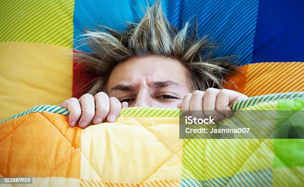 Teenager Not Wanting To Get Out Of Bed Stock Photo - Download Image Now - Teenager, Exhaustion, Tired