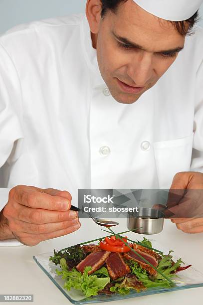 Chef Garnishing Seared Tuna Salad Stock Photo - Download Image Now - Pouring, Men, Only Men