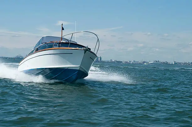 A superb classic british motor boat at speed in Southampton Water on the South Coast of the UK.