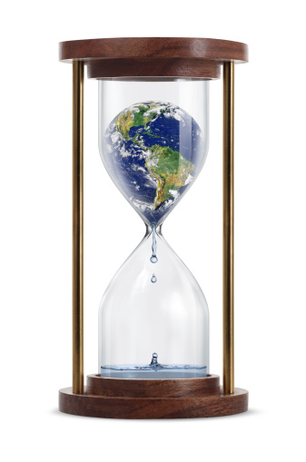 Melting world globe inside the hourglass. Earth transform into a water. Isolated on white background.