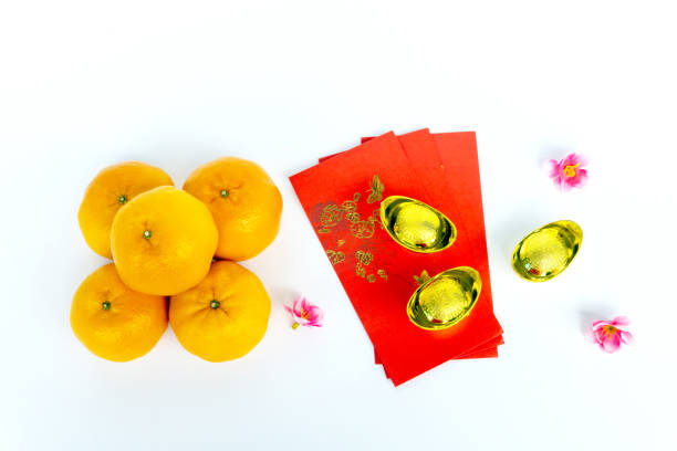 istock Mandarin oranges, golden ingot and angpow 1828826683