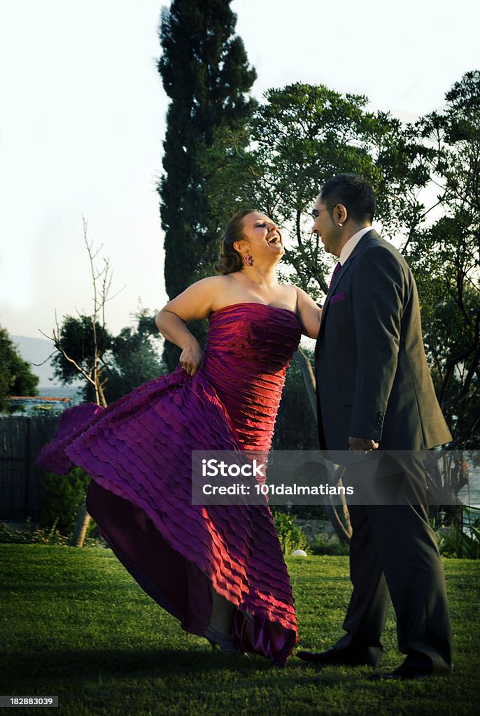 Happy young couple Happy young couple on the grass..young woman dancing.. 20-24 Years Stock Photo