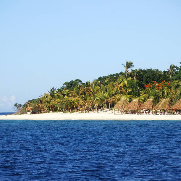 Beach Huts in Fiji White sands and beach huts line the tropical outer islands of Fiji.Please see other pictures from my portfolio: cebolla stock pictures, royalty-free photos & images