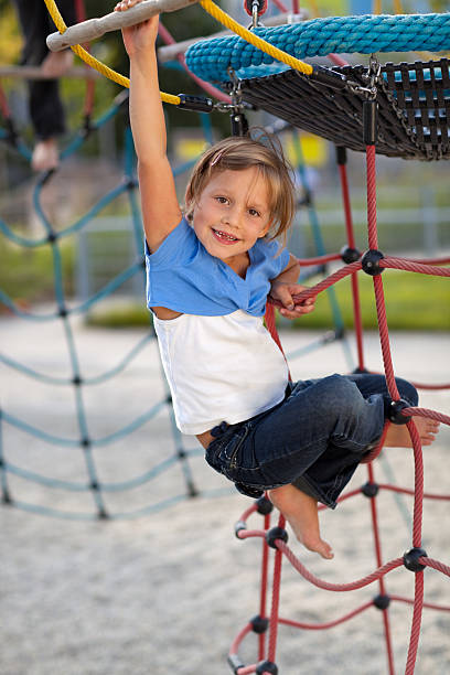 istock smiling girl on playground 182883809