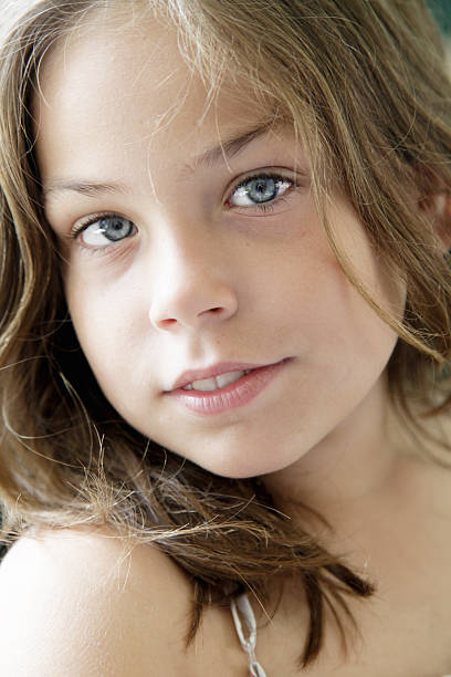 Beautiful nine years old girl stock photo