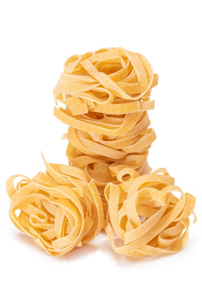istock Five Classic Italian Raw Egg Fettuccine - Isolated on White Background 1828840429