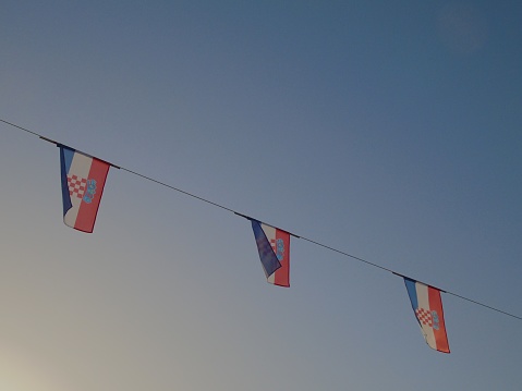 Croatian flags waving along a line in Split, Croatia