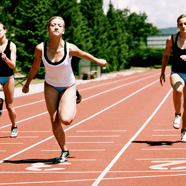 istock Female athletes at the finish line 182884479