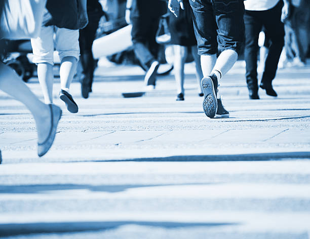 istock People crossing street, motion blur 182884690