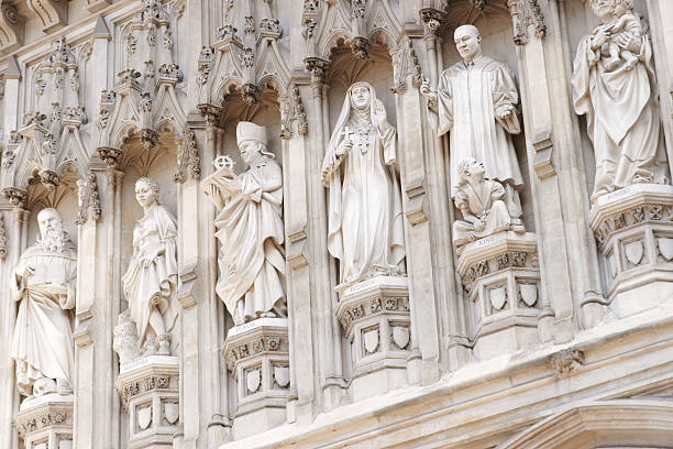 Westminster Abbey detail "Statues over west entrance of Wesminster Abbey including Martin Luther King Jr., Oscar Romero, Janani Luwum, Grand Duchess Elizabeth, Manche Masemola and Maximilian Kolbe" martin luther king jr images stock pictures, royalty-free photos & images
