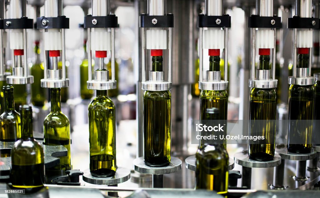 Close-up of bottles in a bottling plant factory Wine Bottling Plant in a wine factory Bottling Plant Stock Photo