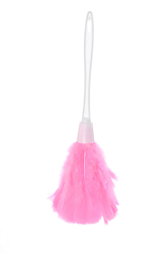 Pink feather duster isolated on white