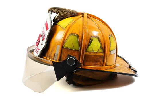 Yellow firefighter's helmet with firefighter shield with Lieutenant, 35 and Fire-Rescue on it.