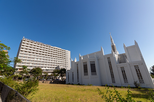 Maputo, Mozambique - December 03, 2023: Cathedral of Our Lady of the Immaculate Conception near independence square and historic Pestana Rovuma Hotel