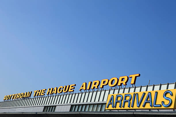 istock arrivals sign against a blue sky 182885629