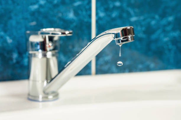 istock A drop of water drips from a leaky faucet 1828857710