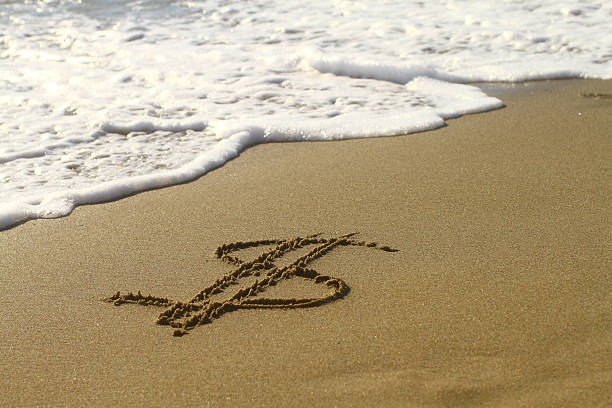 istock Dollar sign on the beach 182885797