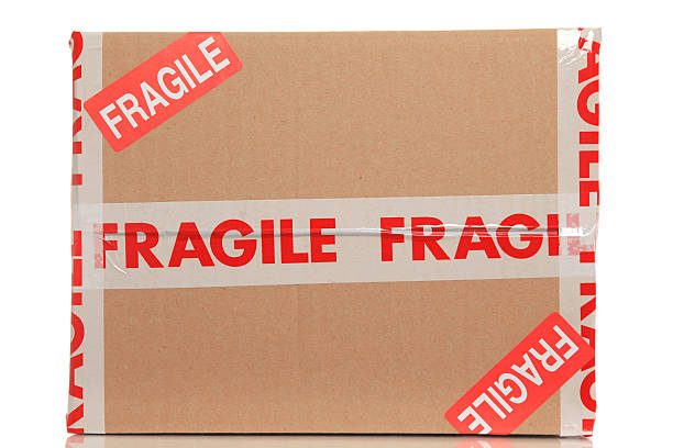 istock Box marked fragile in tape and stickers 182886180