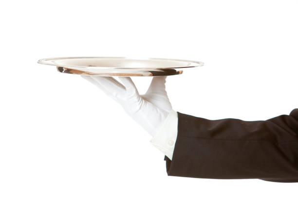 istock Single silver tray held by butler's hand with gloves 182886526
