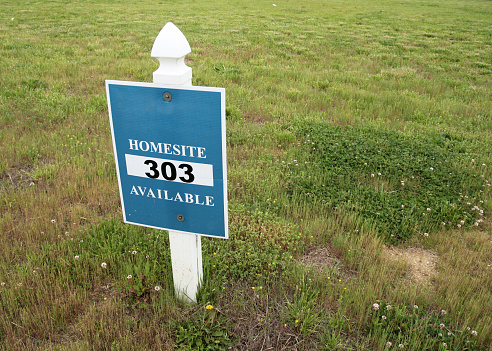 'Homesite Available' sign in an empty lot.