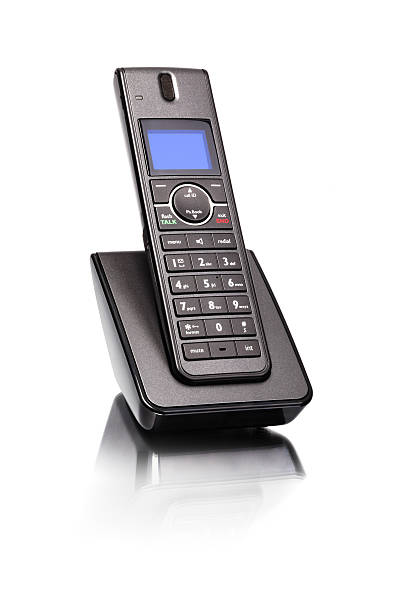 Land line phone Modern cordless land line telephone sitting in charger base cordless phone stock pictures, royalty-free photos & images