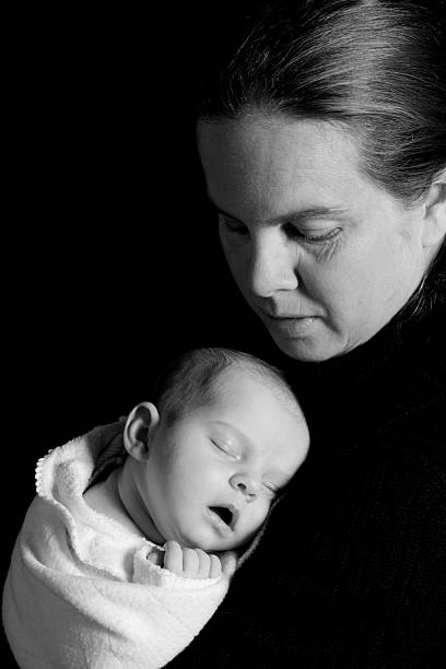 istock Sleeping Newborn On Mothers Shoulder 182887525