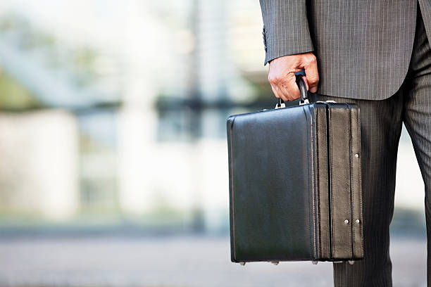 istock Businessman Holding a Briefcase Outdoors 182887619