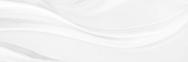 istock White gray satin texture that is white silver fabric silk background with beautiful soft blur pattern natural. 1828878352