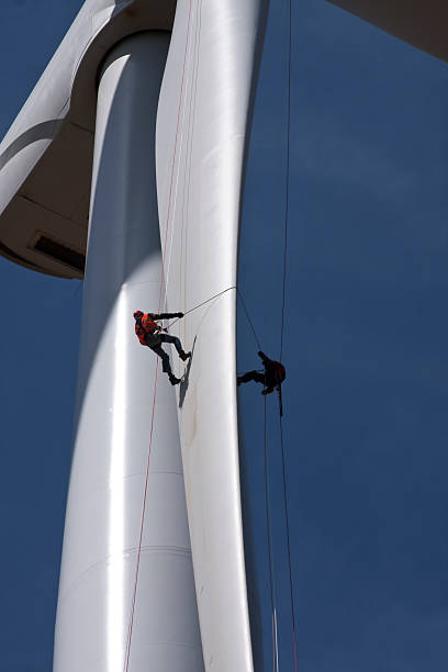 wind turbine working on the wing of wind turbine safety harness photos stock pictures, royalty-free photos & images