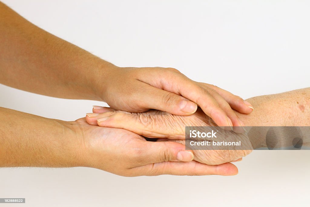 Old hand in young hands Consoling Stock Photo