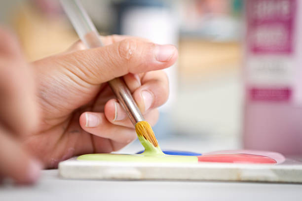 istock Child's Hand with Paintbrush 182889074
